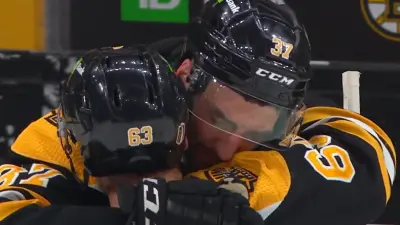 Patrice Bergeron hugs teammate