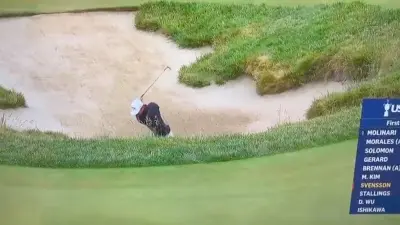 Adam Svensson hits a bunker shot at the US Open