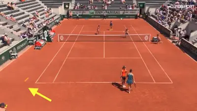 An errant ball hits a ball girl at the French Open