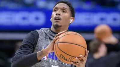 Lou Williams warms up before a game