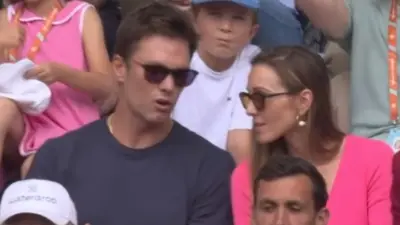 Tom Brady sits with Jelena Djokovic at the French Open