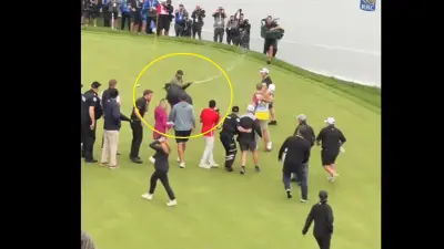 Adam Hadwin gets tackled