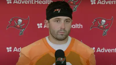 Baker Mayfield talks in front of a microphone