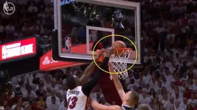 Bam Adebayo hangs on the rim