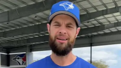 Brandon Belt in a Blue Jays hat
