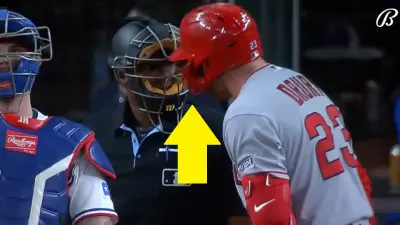 Brandon Drury bumps an umpire