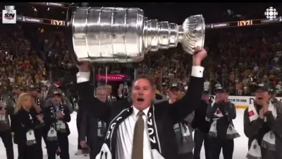 Bruce Cassidy holds up the Stanley Cup