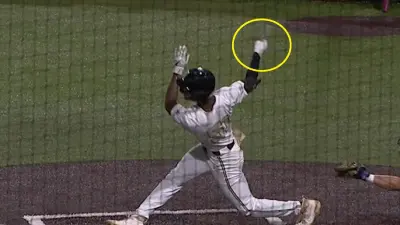 Enrique Bradfield Jr holding a bat shard