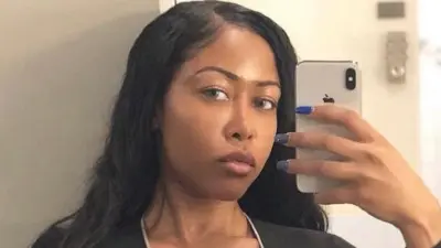 Moriah Mills holds up her phone