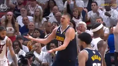 Nikola Jokic holds out his hands