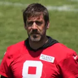 Aaron Rodgers looking on with the sun in his eyes