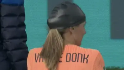Danielle van de Donk wears a swim cap