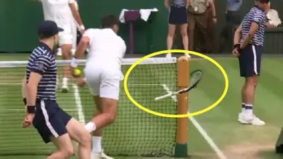 Novak Djokovic smashes his racket at Wimbledon