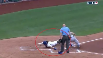 Bobby Witt Jr dives into home plate