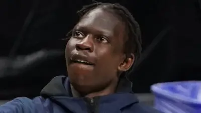 Bol Bol looking to the side