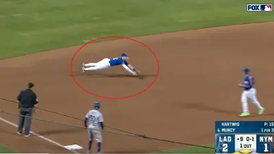 Brett Baty dives for a ball