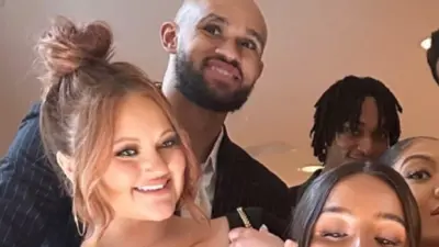 Derrick White sports a shaved head