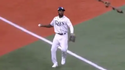 Randy Arozarena holding the baseball