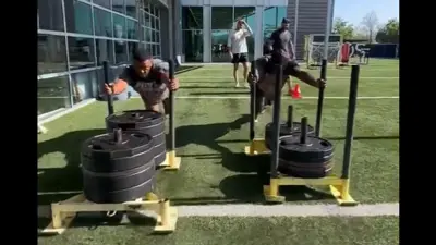 Saquon Barkley and Deebo Samuel on a sled