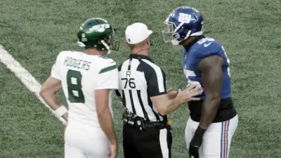 Aaron Rodgers jaws at a defender