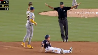 Angel Hernandez calls a runner safe