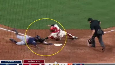 Logan O'Hoppe reaches for a tag at the plate