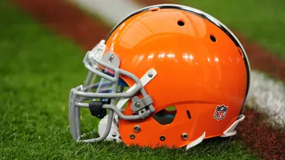 A Cleveland Browns helmet on the grass