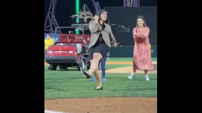 A woman mimics the Elaine dance