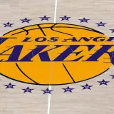 The Lakers logo at half court