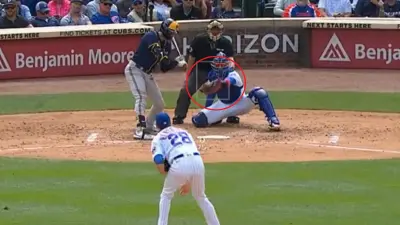 Miguel Amaya catches a pitch