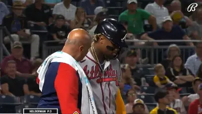 Ronald Acuna Jr with a trainer