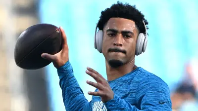 Bryce Young warms up before a game