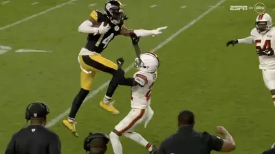 George Pickens tries to hurdle Denzel Ward during Steelers-Browns game