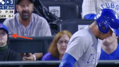 Steve Bartman impersonator behind home plate during Cubs-Rockies game