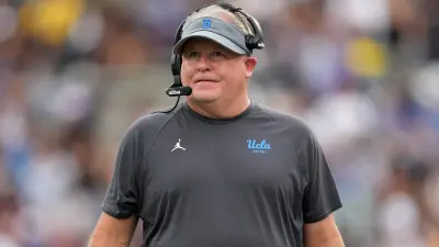 Chip Kelly in a headset