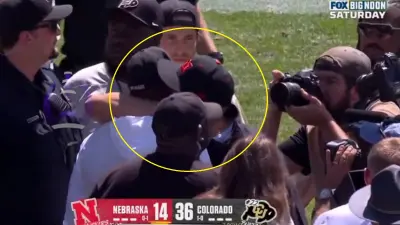 Matt Rhule hugs Deion Sanders