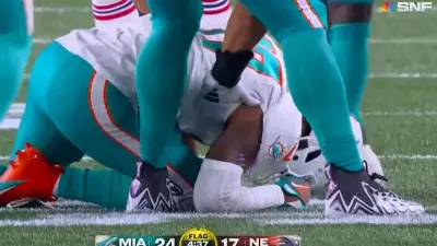 Jaylen Waddle down on the field