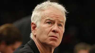John McEnroe looks on