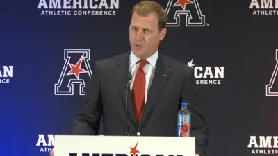 Rhett Lashlee at the podium