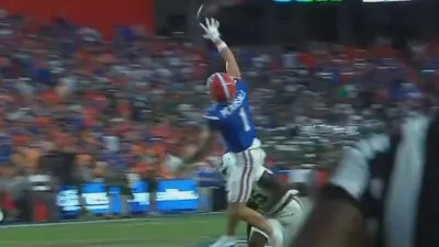 Ricky Pearsall reaches for a catch