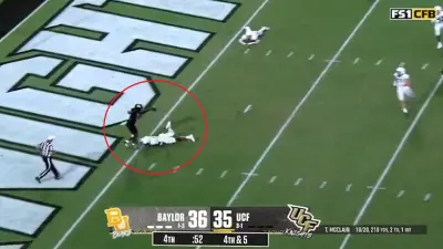 Timmy McClain avoids a tackle
