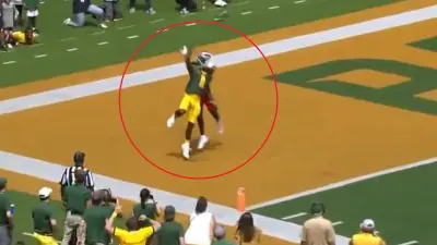 A Utah DB grabs a Baylor player