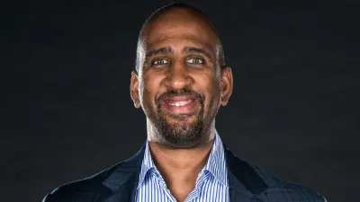 Nuggets GM Calvin Booth smiling