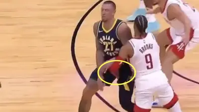 Dillon Brooks with a low blow to Daniel Theis during Rockets-Pacers preseason game. Brooks was ejected.