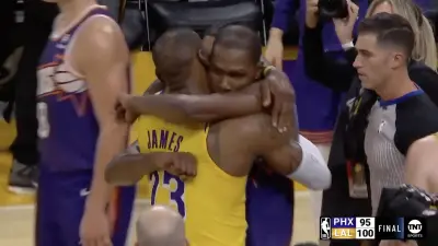 LeBron James and Kevin Durant share an embrace after a Lakers-Suns game