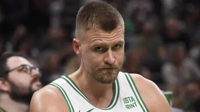 Kristaps Porzingis looks on