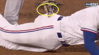 Marcus Semien getting tagged out by his batting glove during ALCS Game 4 between the Rangers and Astros