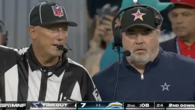 Mike McCarthy talking to a referee during Cowboys-Chargers
