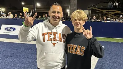 Steve Sarkisian poses with Knox Kiffin