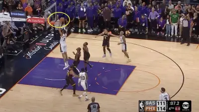 Victor Wembanyama with a putback dunk during a Spurs-Suns game